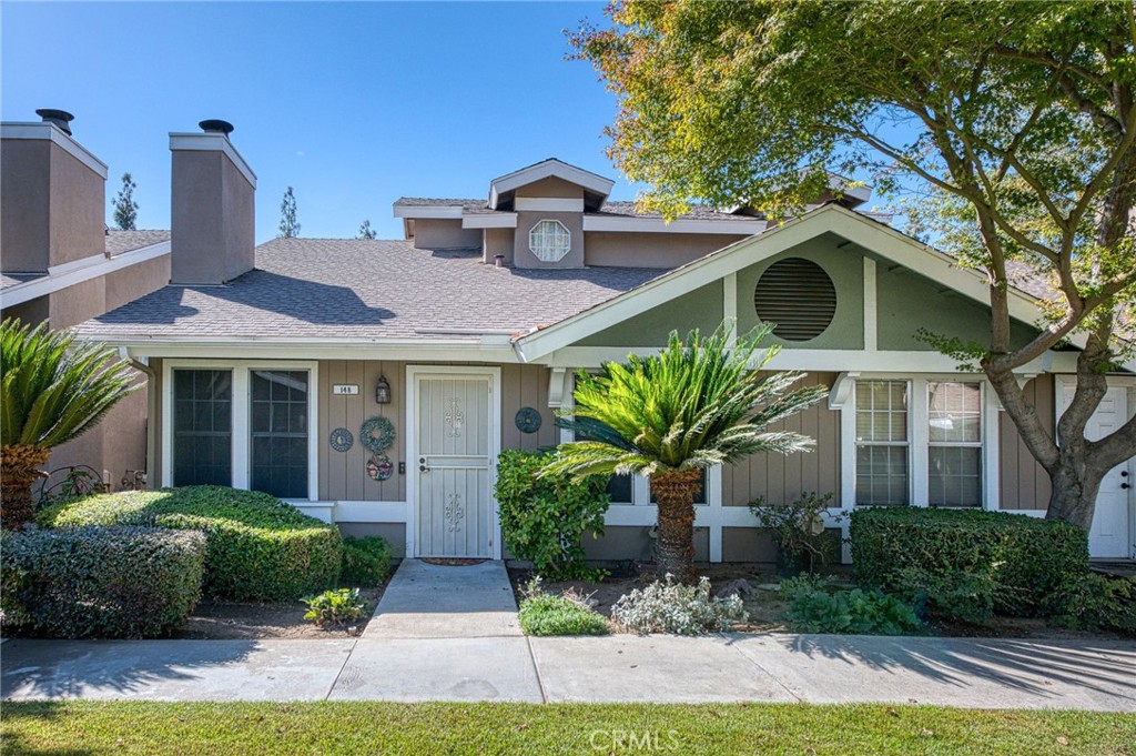 a front view of a house with garden