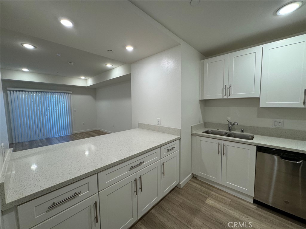 a kitchen with a sink and cabinets