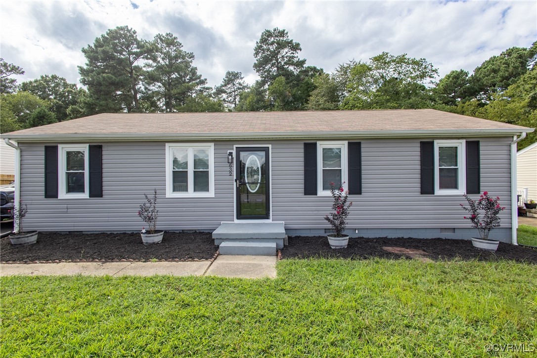 a view of house with backyard