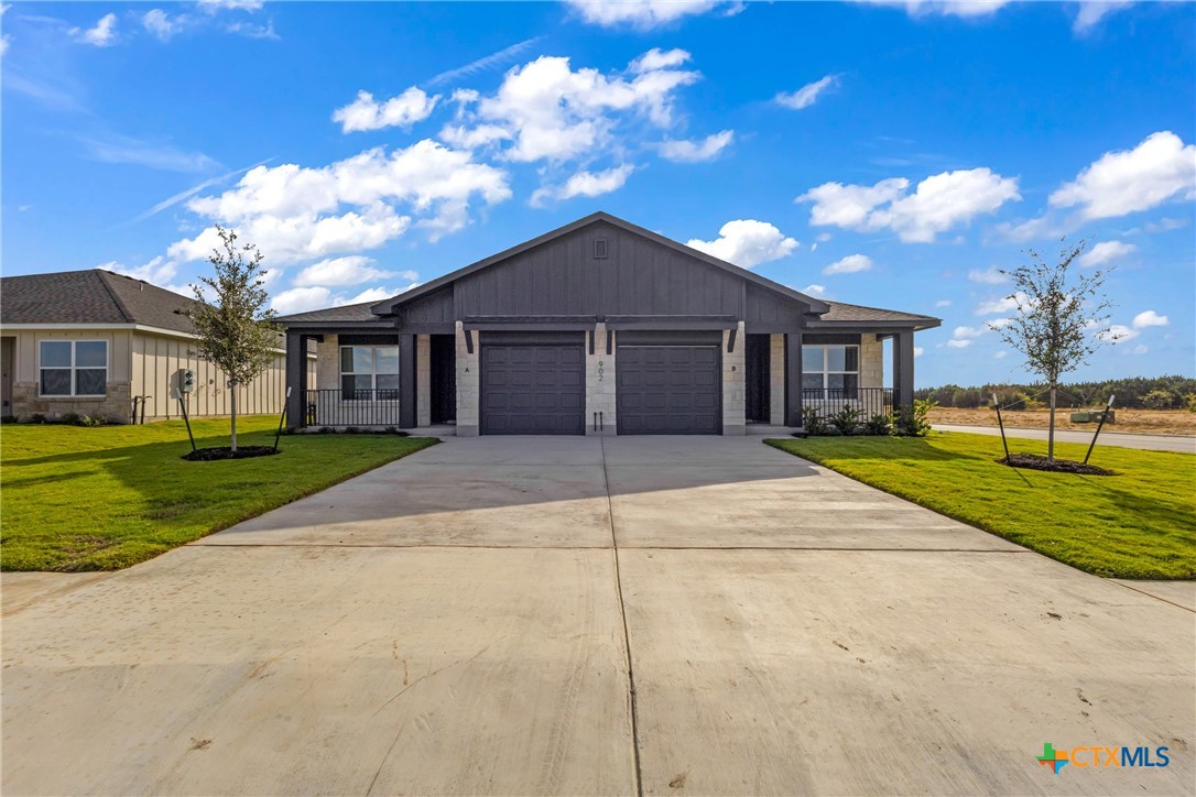 a view of house with yard