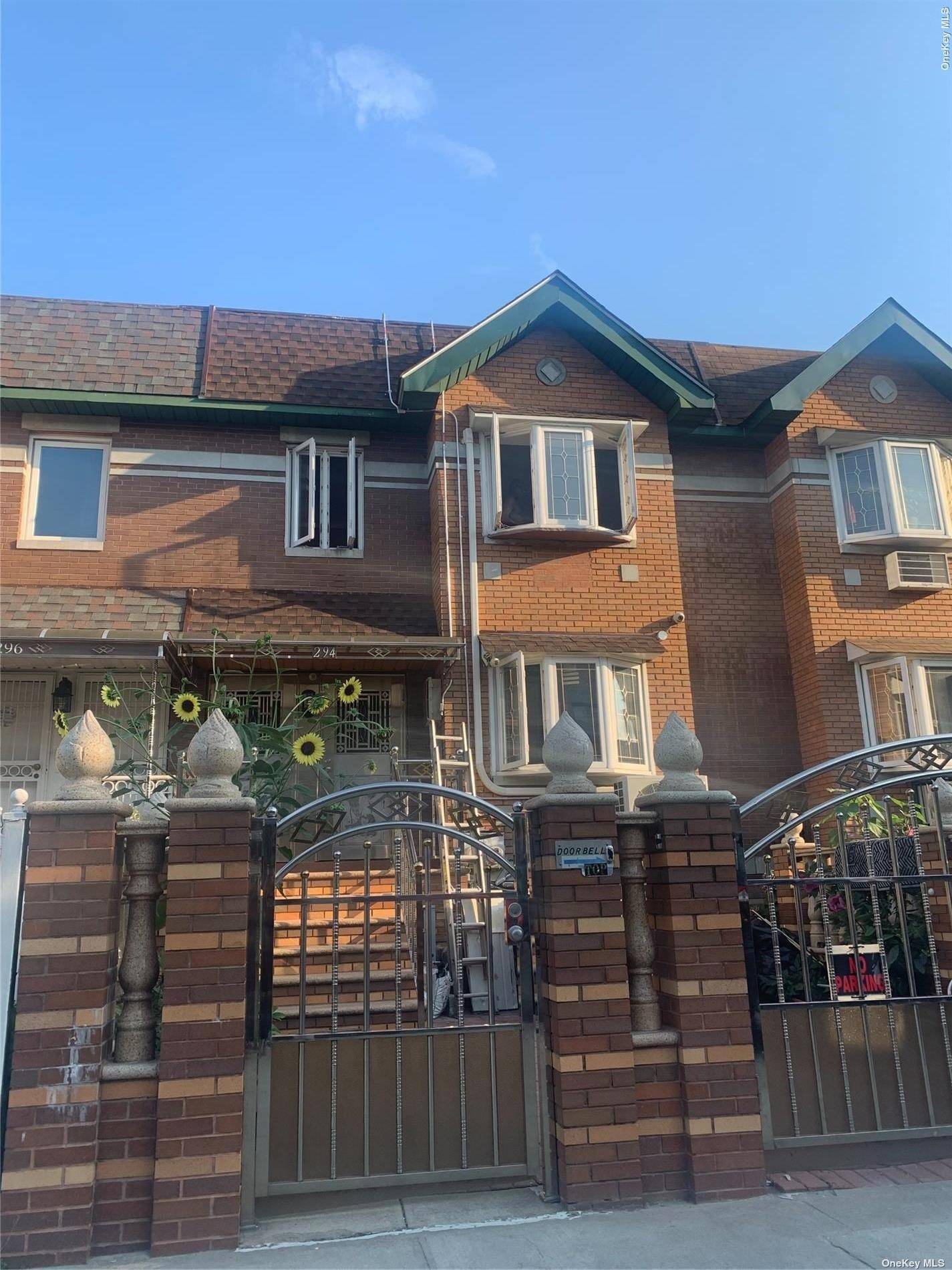 a front view of a house with glass windows