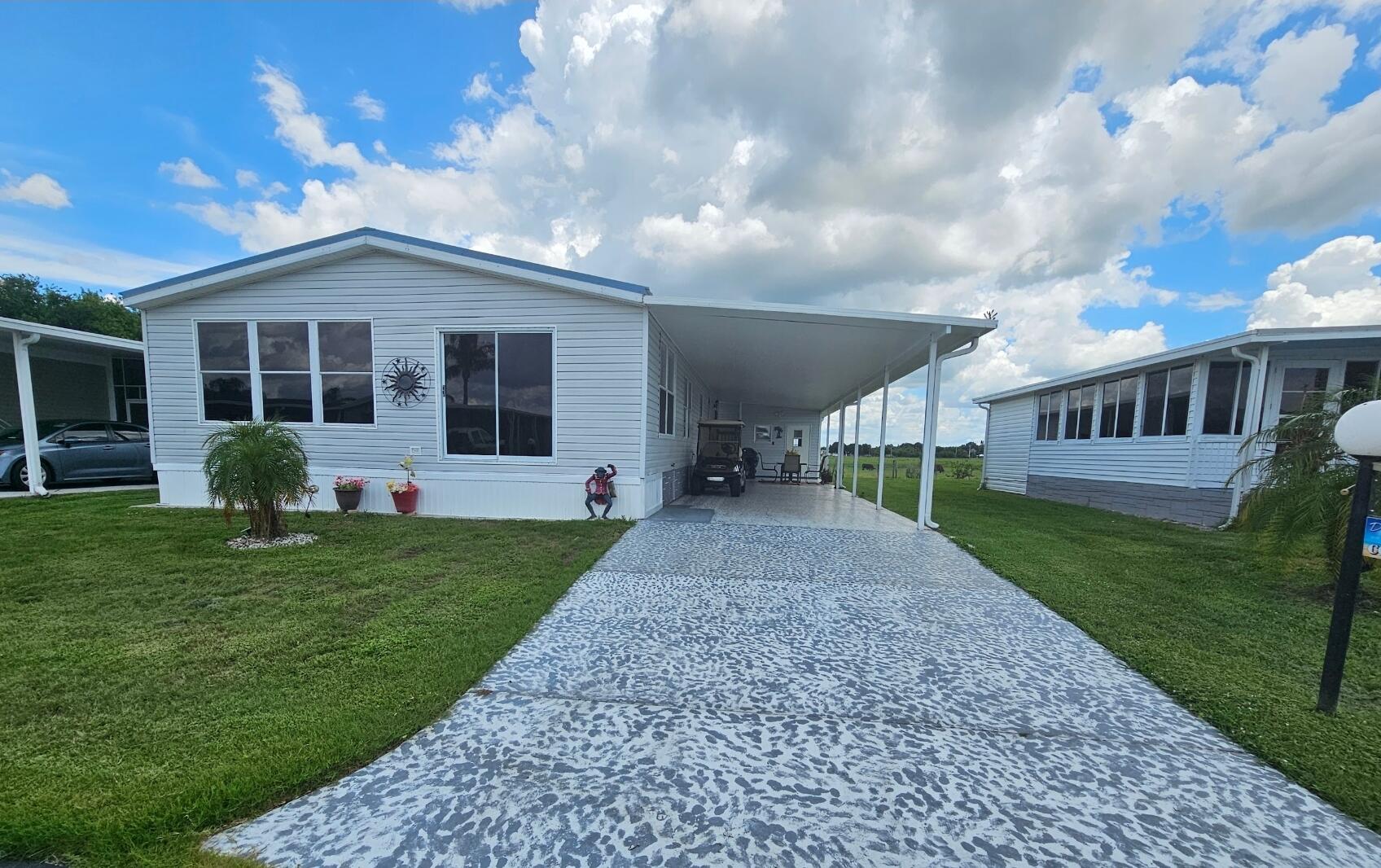 a view of a house with a yard and garden