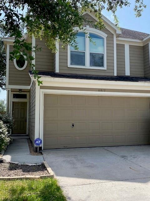 a front view of a house with yard