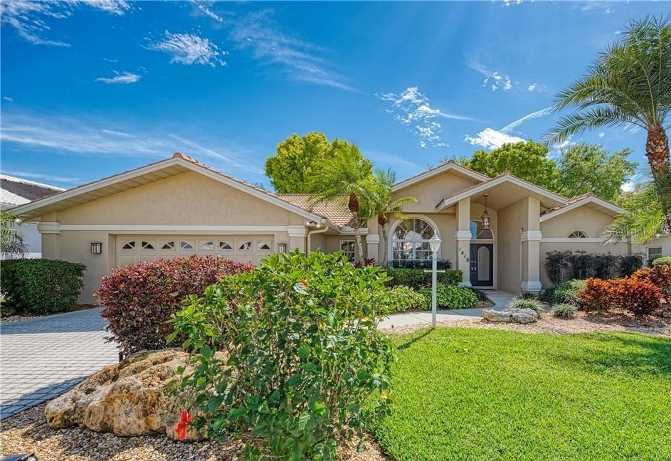 front view of a house with a yard