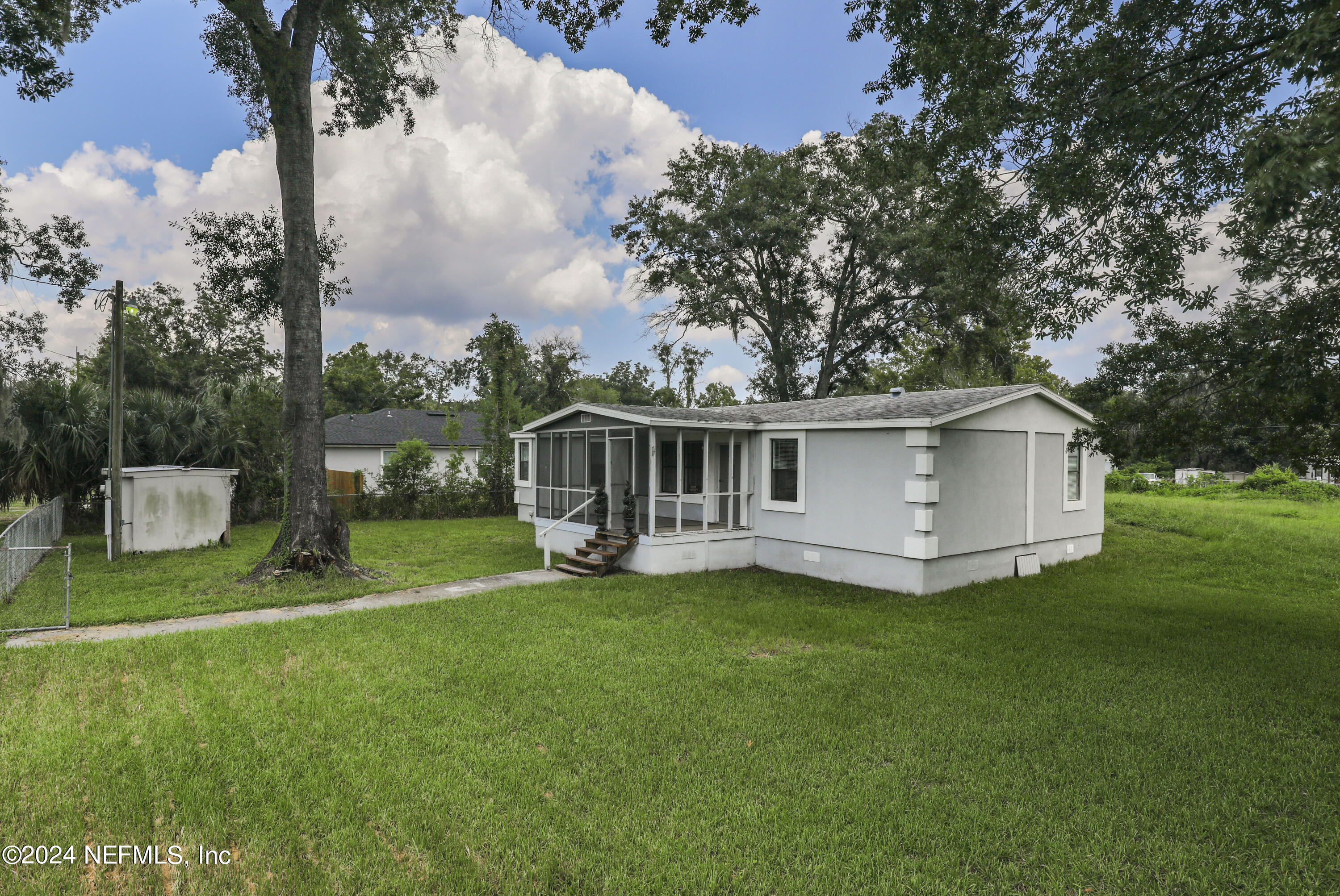 a view of a house with a yard porch and sitting area