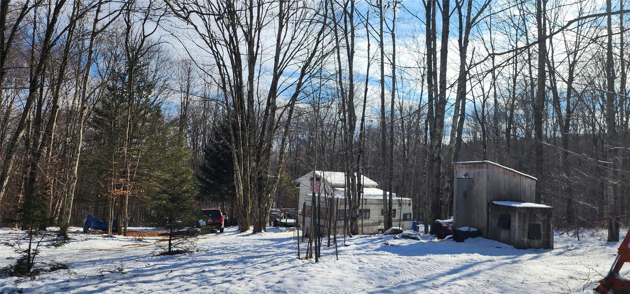 View of yard layered in snow