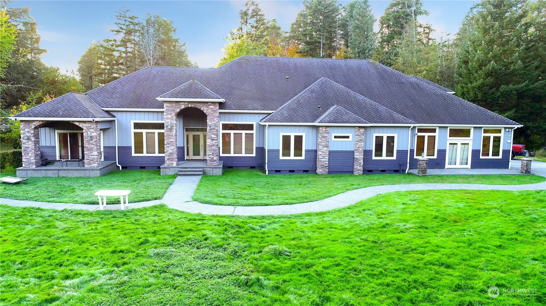 a front view of a house with a yard and porch