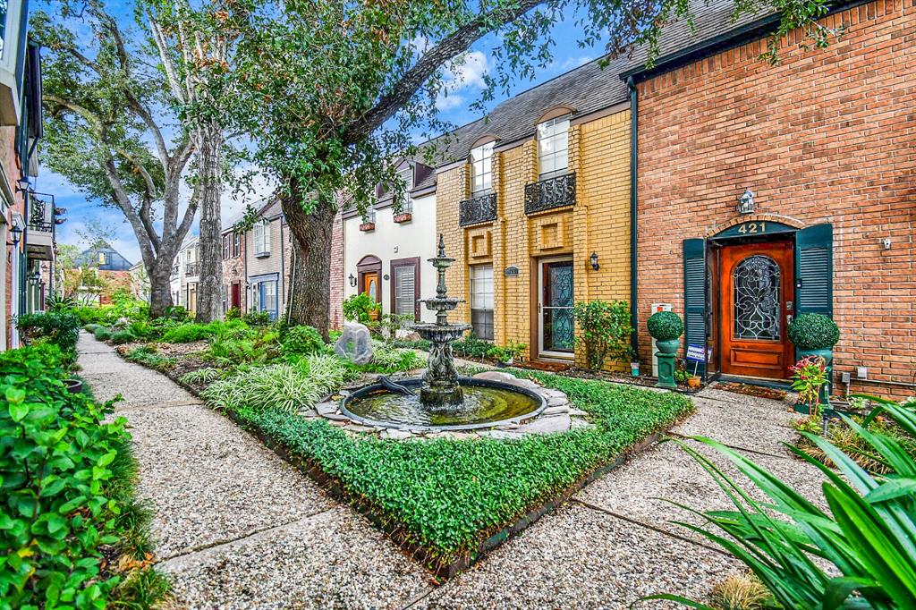 Welcome home to lush landscape and water fountain sounds