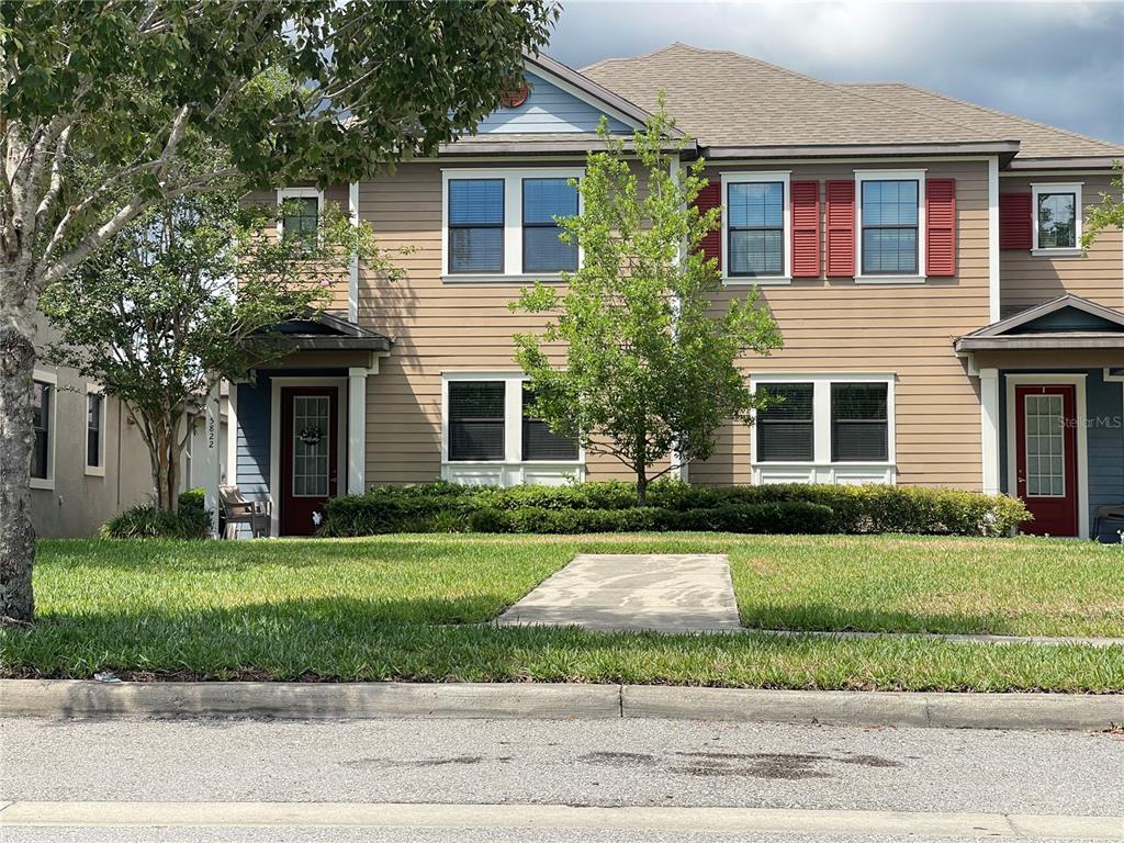 a front view of a house with a yard