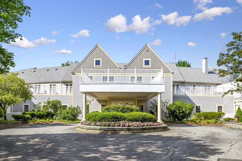 front view of a house with a garden