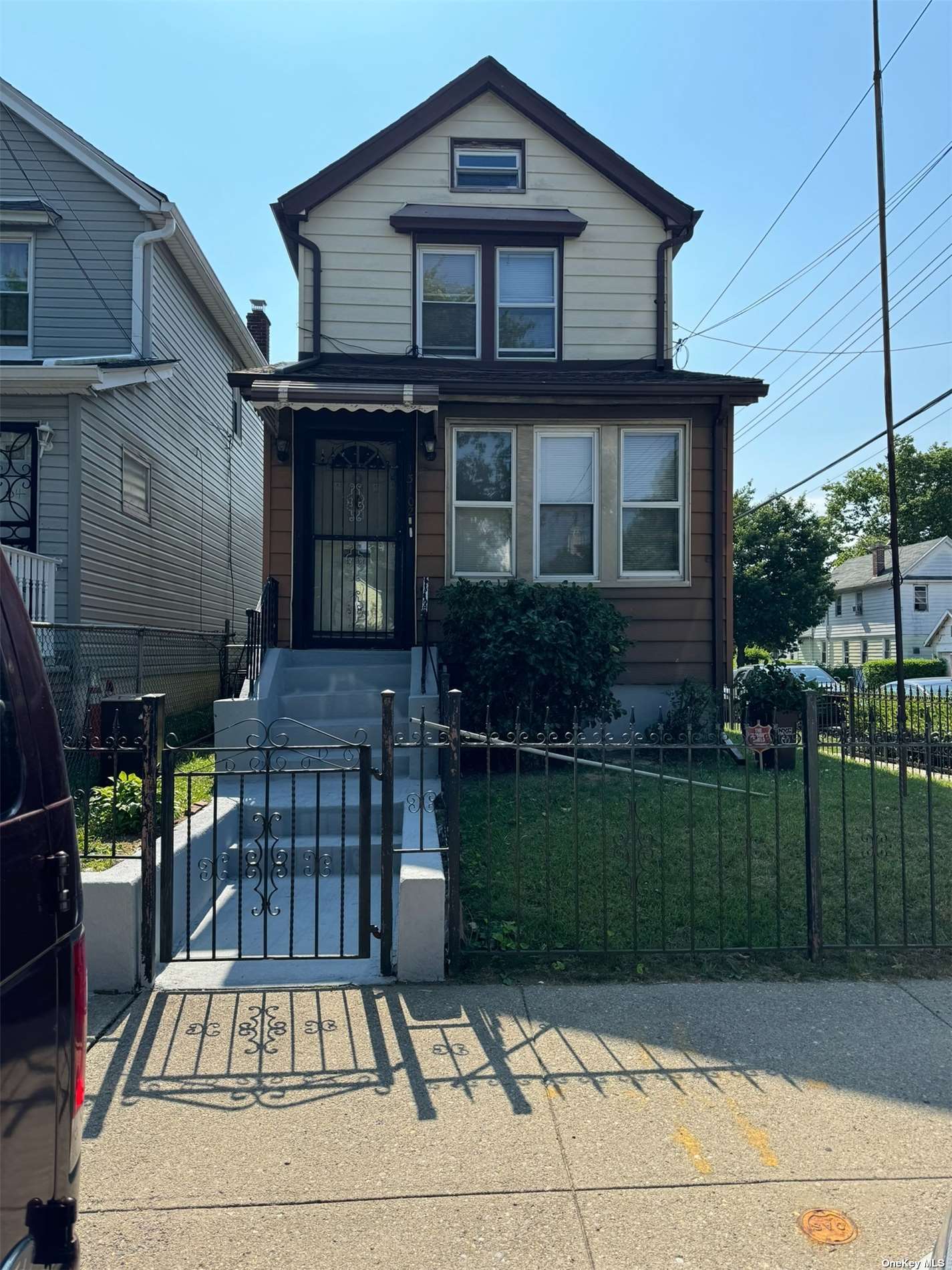 a front view of a house with a garden