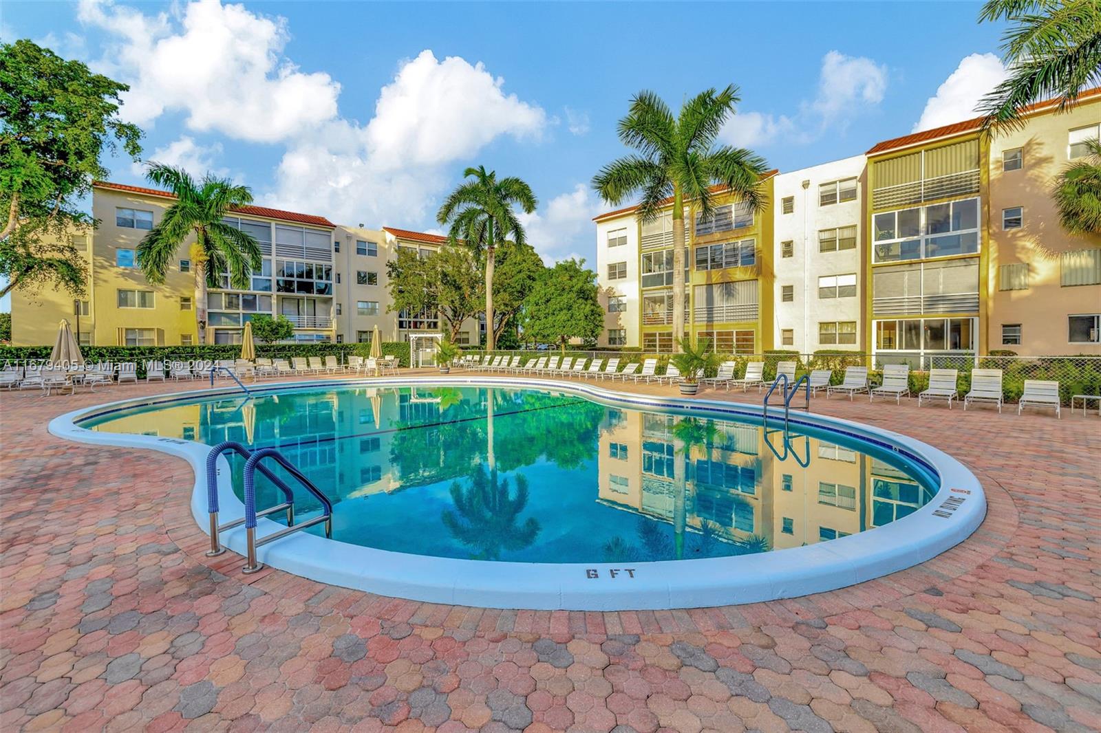 a view of a swimming pool with a sitting space