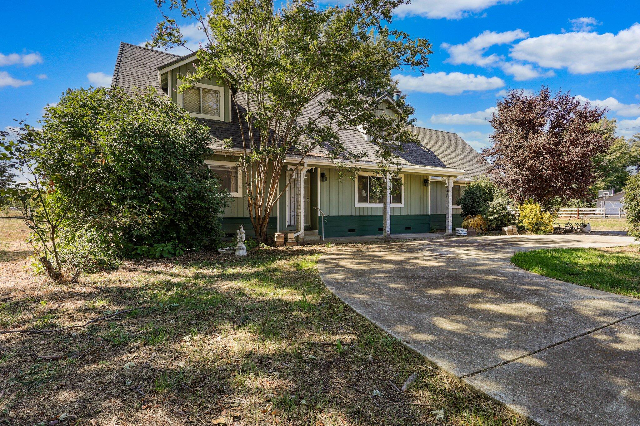 front view of a house with a yard