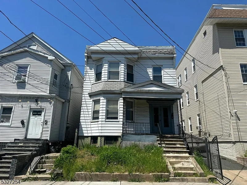 front view of a house with a small yard