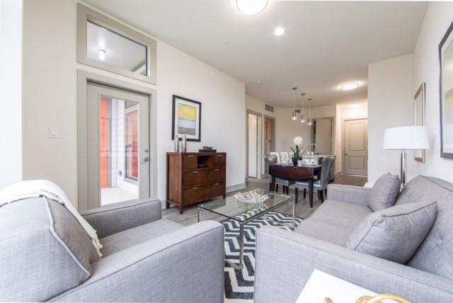 a living room with furniture and a window