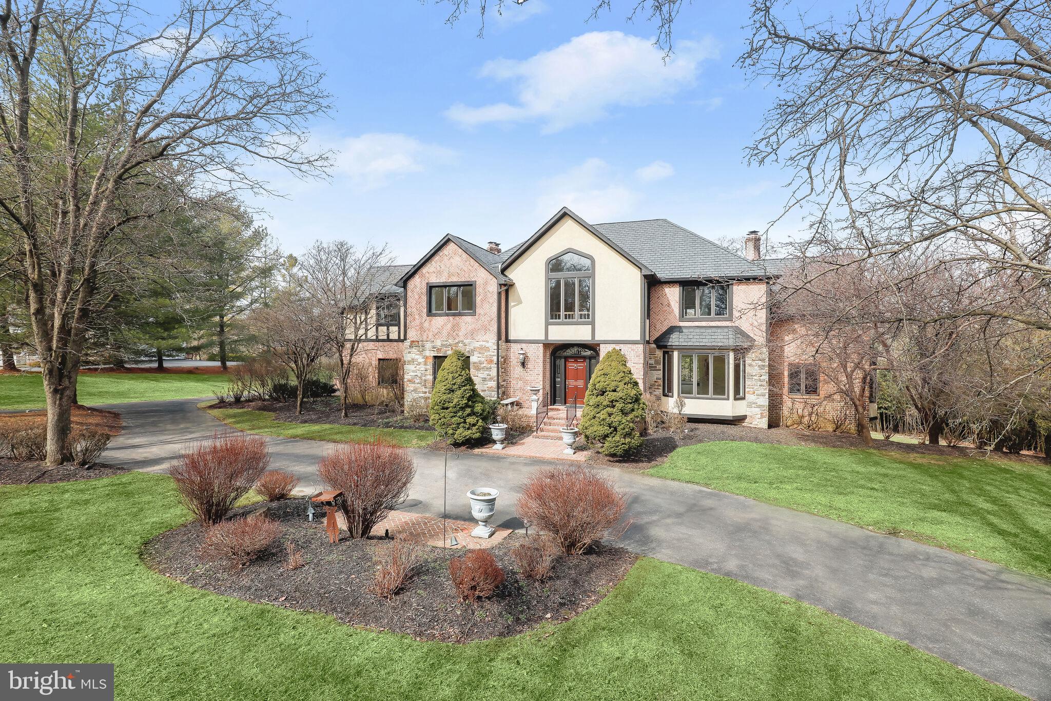 a view of a house with backyard sitting area and garden