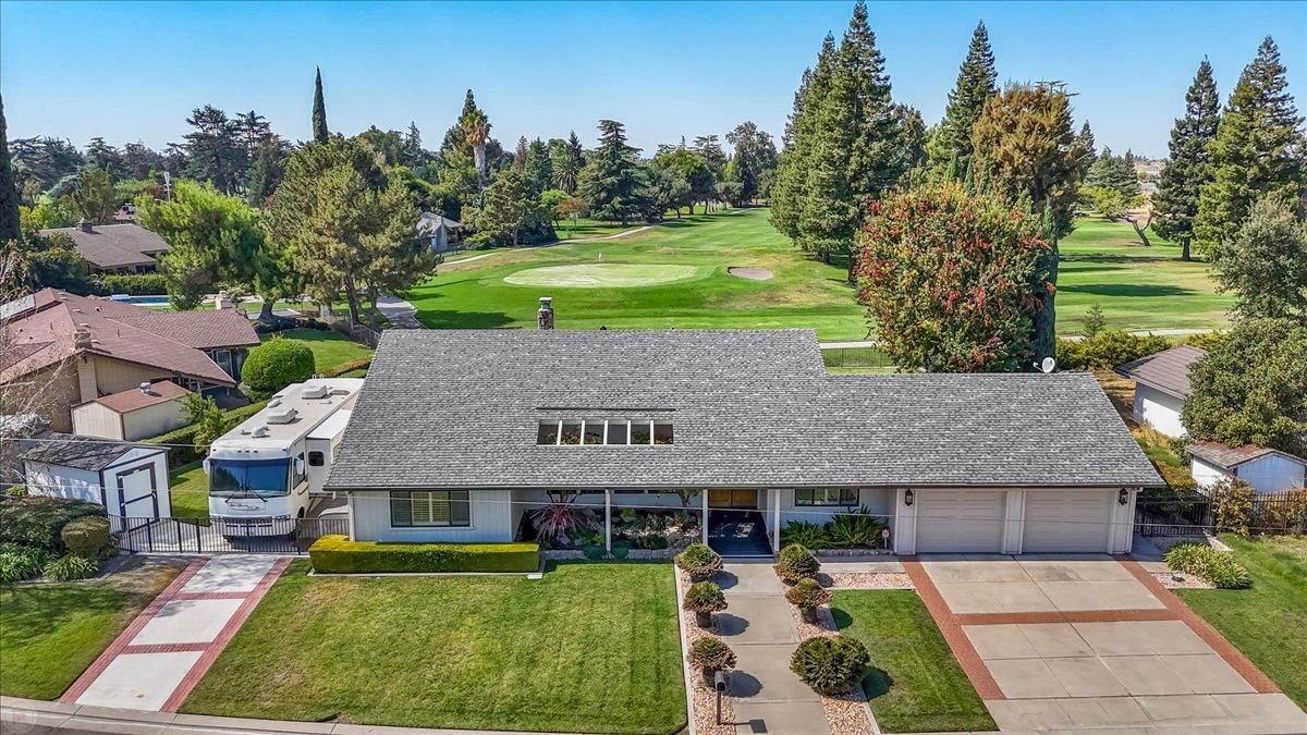 a aerial view of a house with big yard