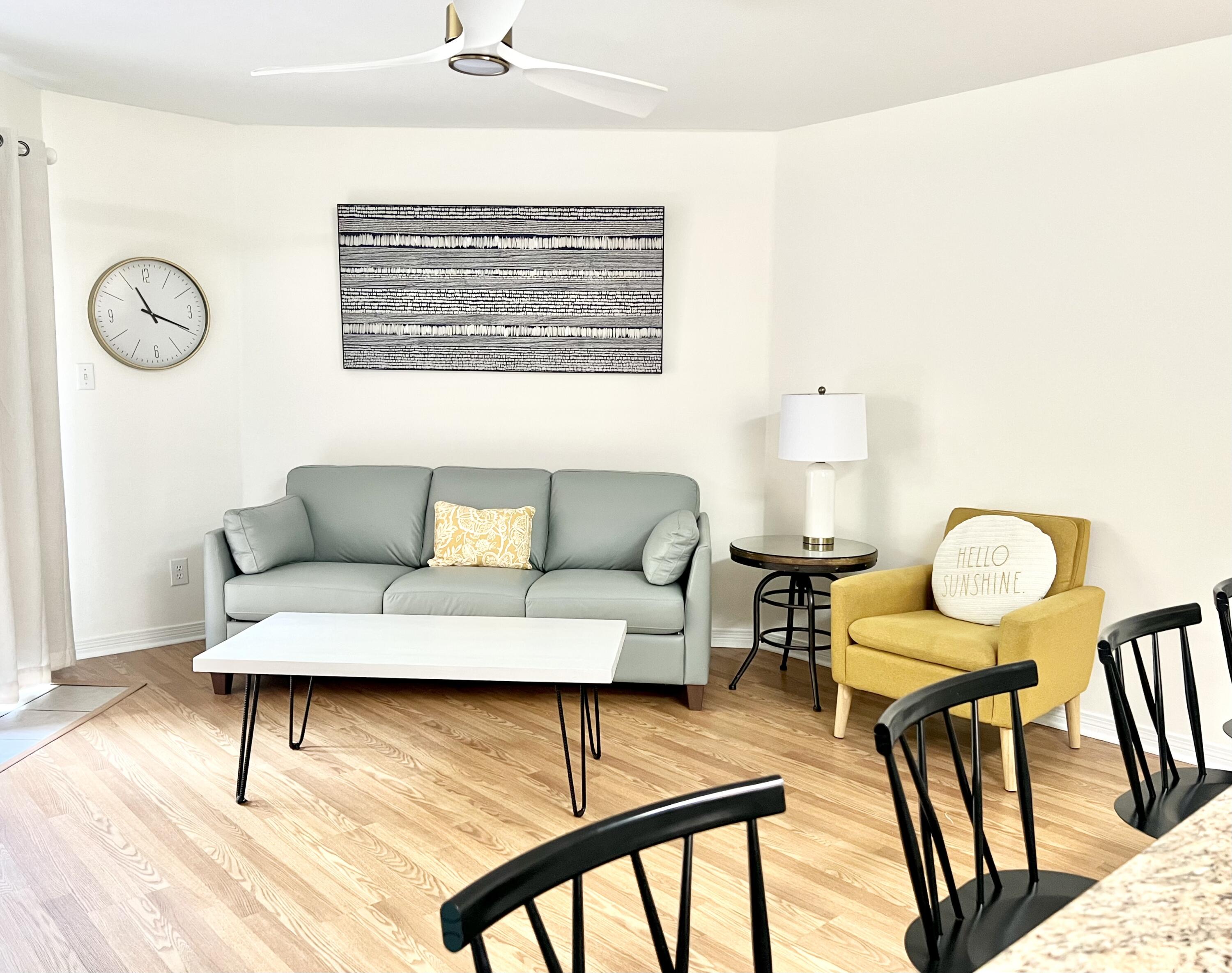 a living room with furniture and a table