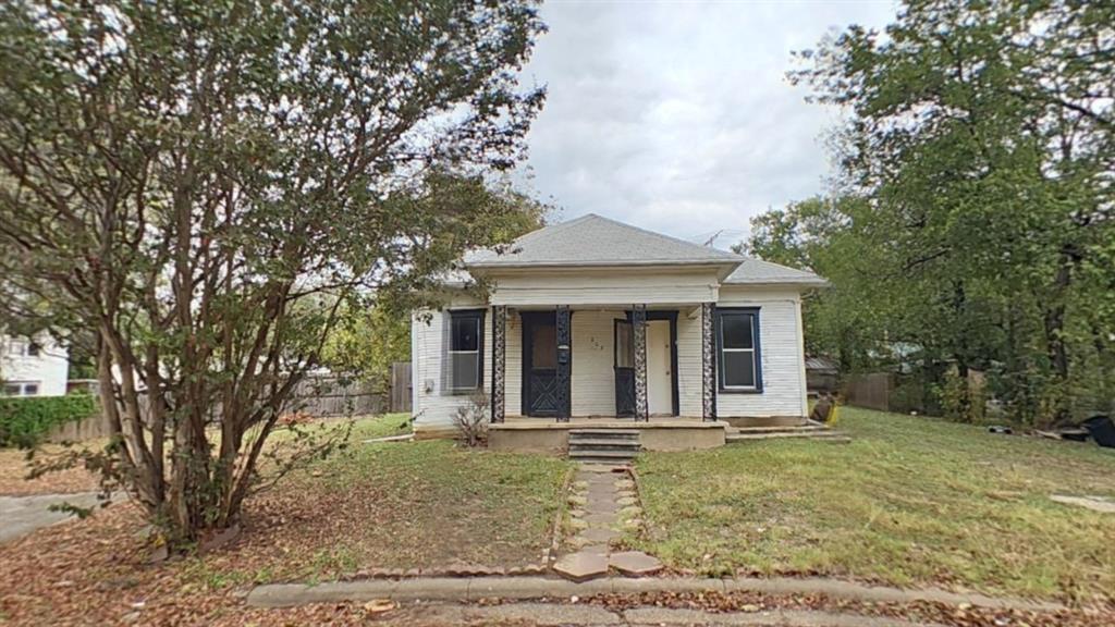 front view of a house with a garden