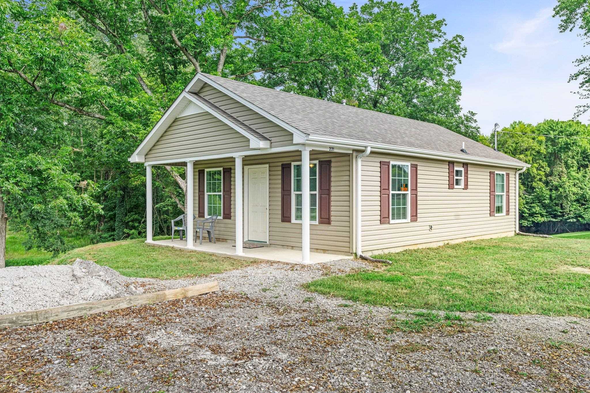 View of front of property featuring a front lawn