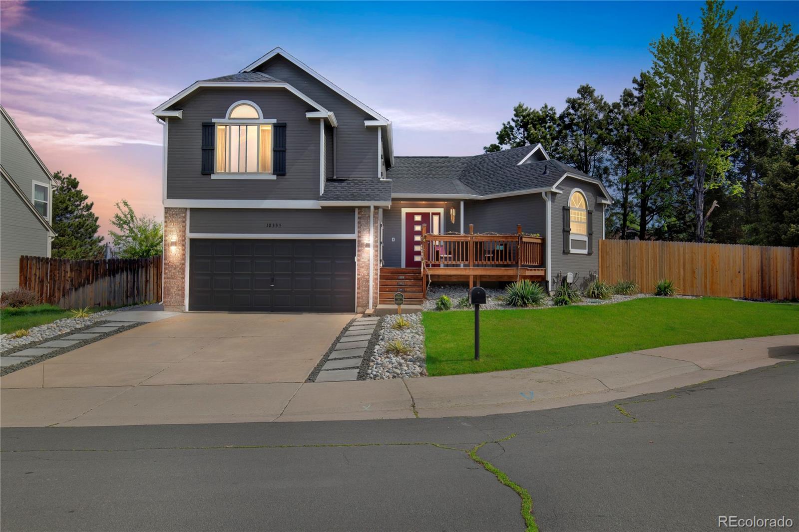 front view of a house with a yard