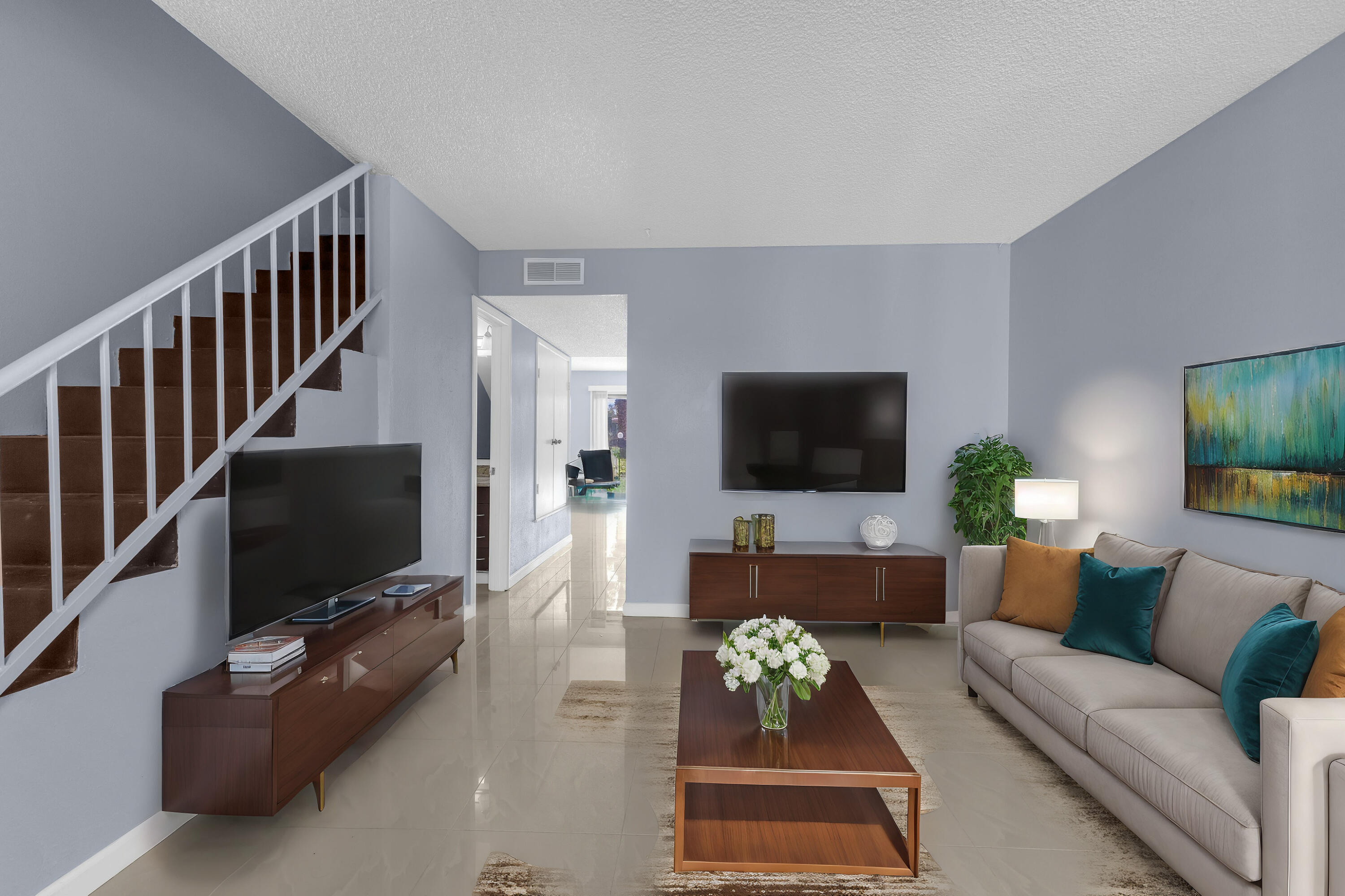 a living room with furniture and a flat screen tv