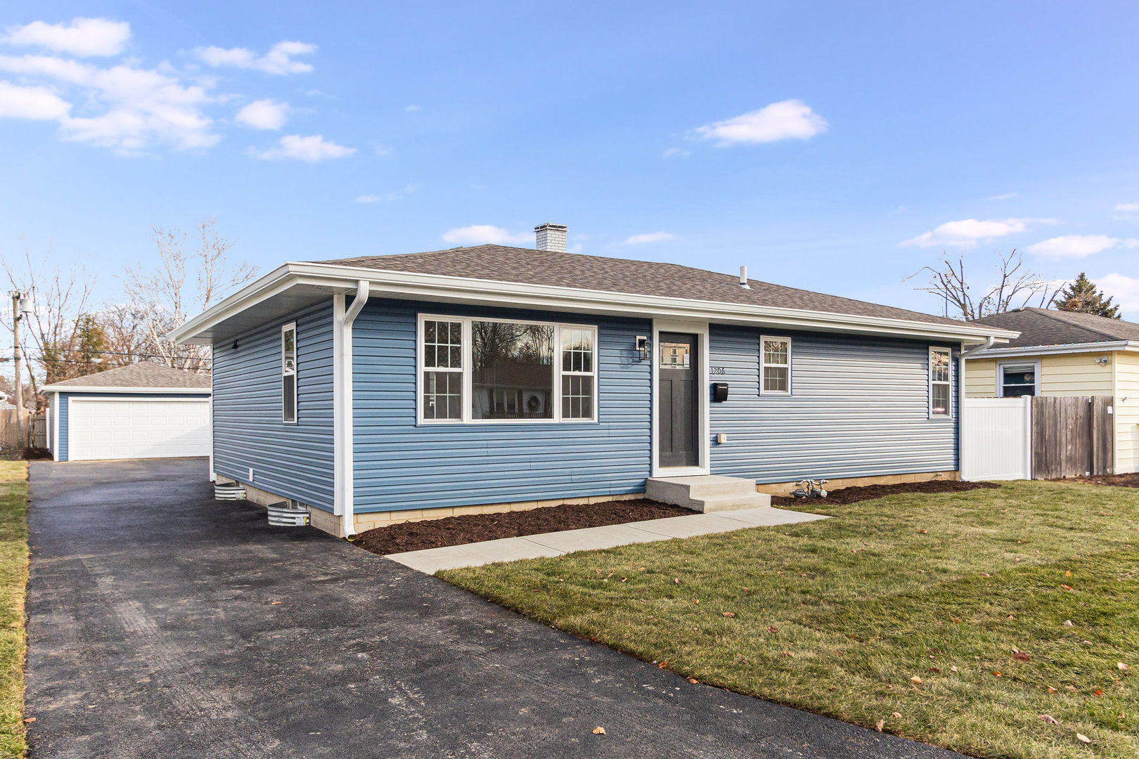 a front view of a house with yard