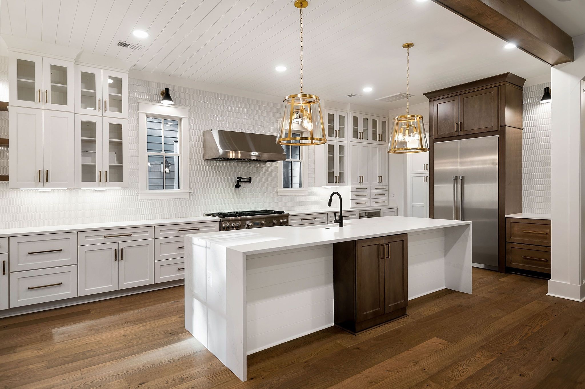 a open kitchen with stainless steel appliances granite countertop a sink a stove and a refrigerator