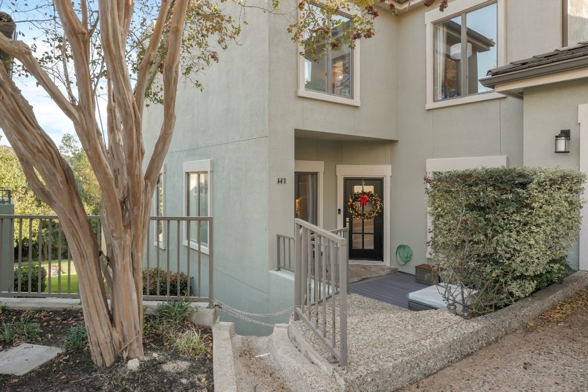 a view of a house with a tree in front