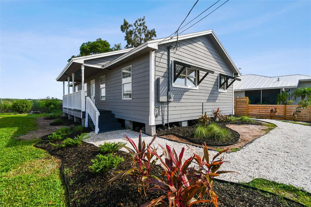 a front view of house with yard and seating space