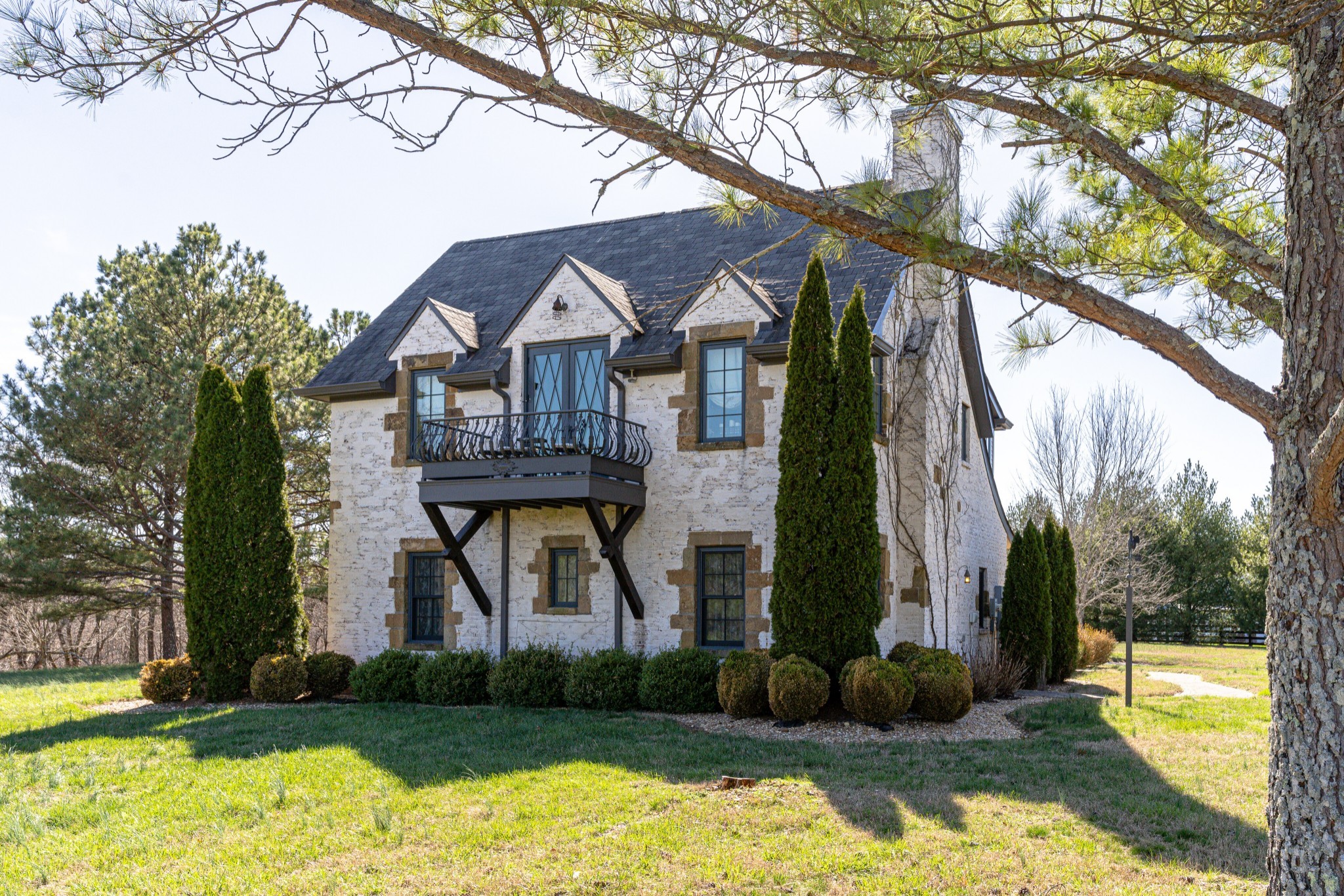 a front view of a house with garden