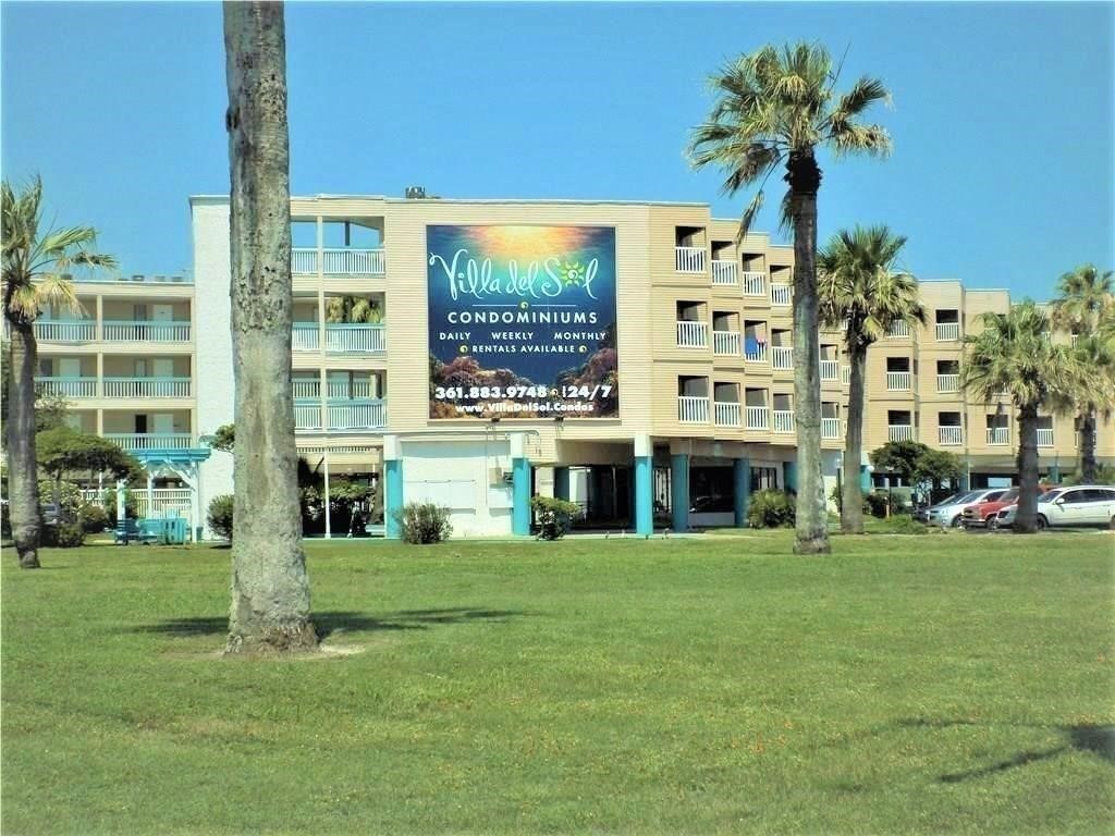 a front view of building with yard