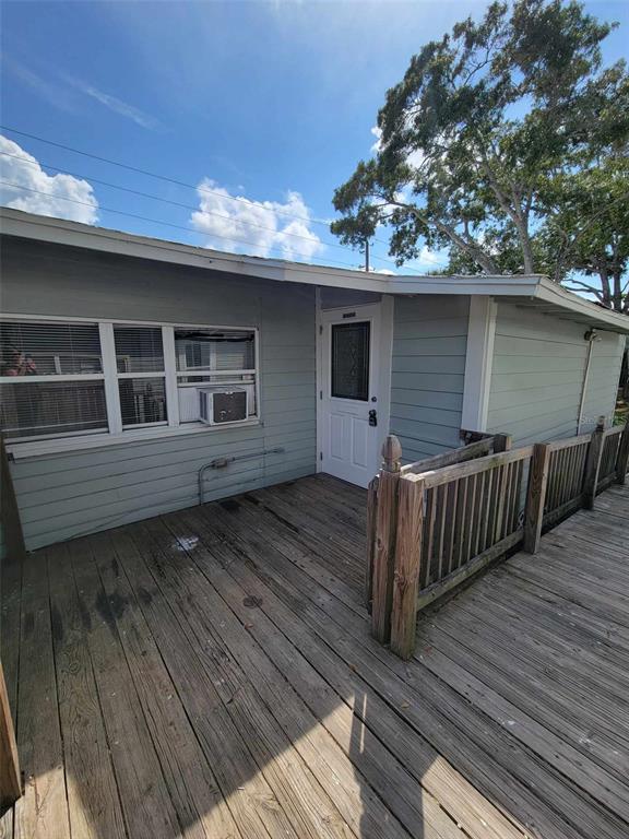 a backyard of a house with wooden deck