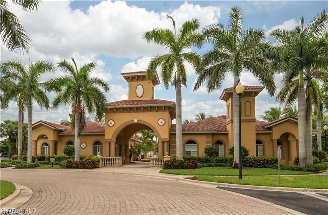 a front view of multiple houses with yard