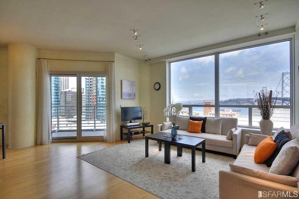 a living room with furniture and a large window