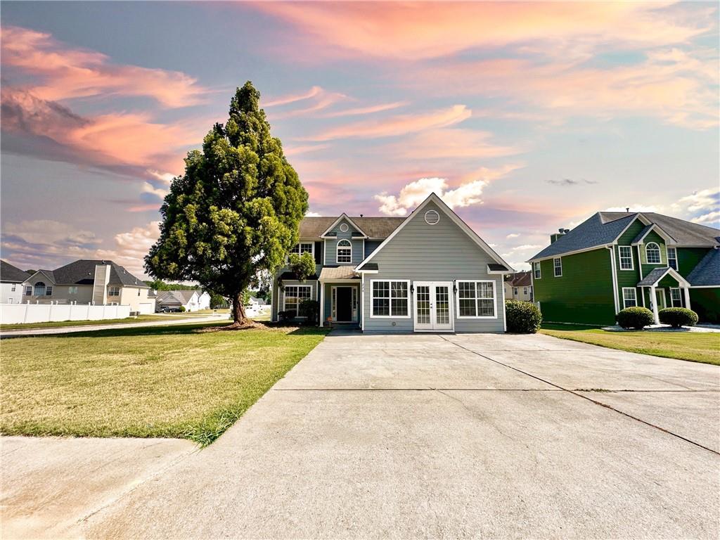 a front view of a house with a yard