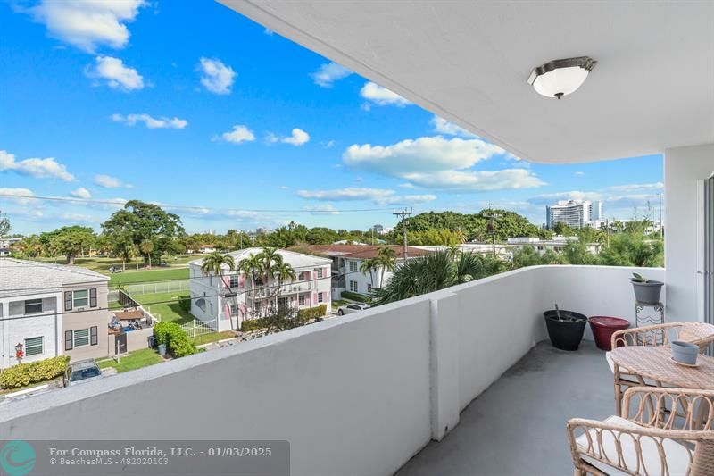 a view of a balcony with city view