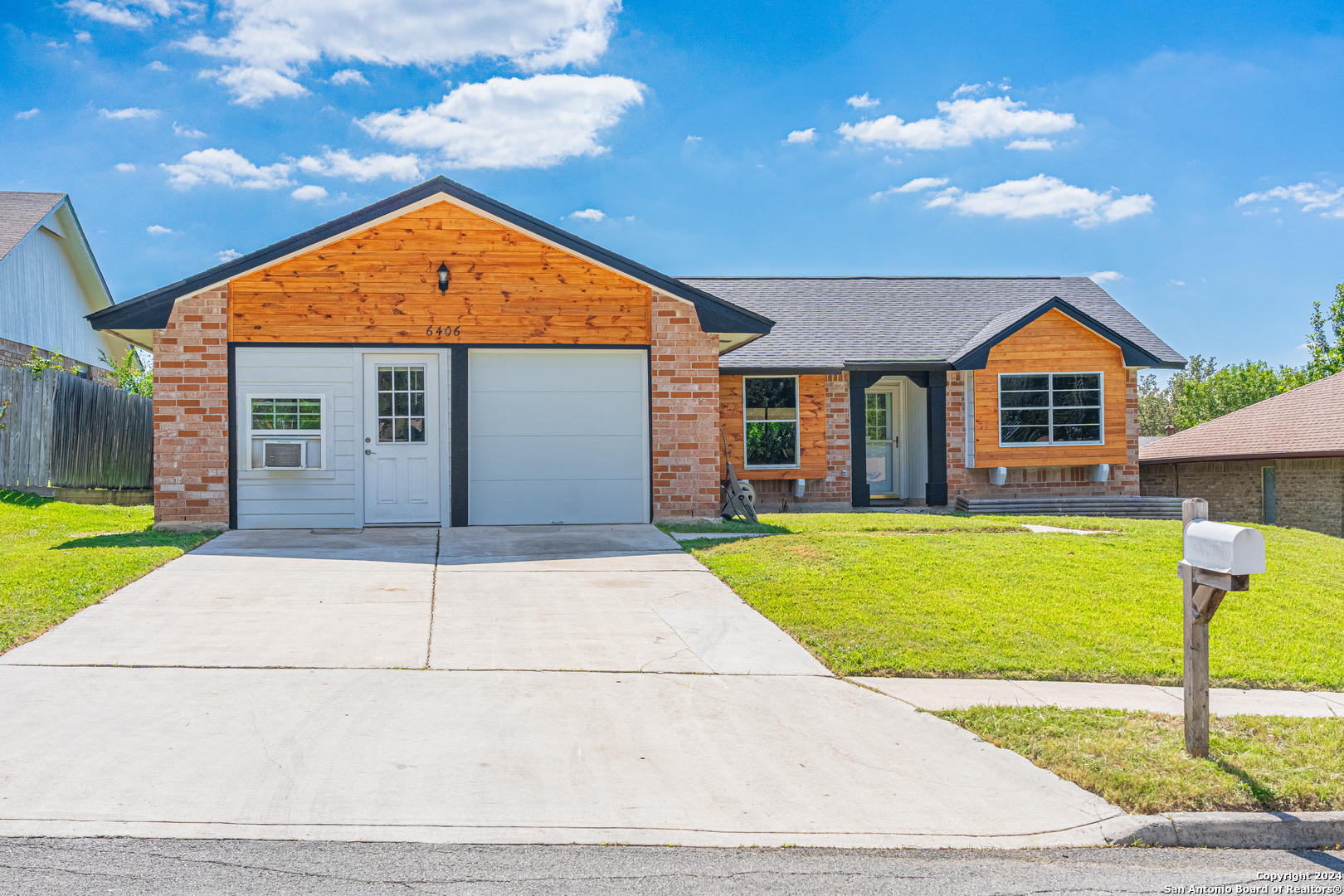 a front view of house with yard