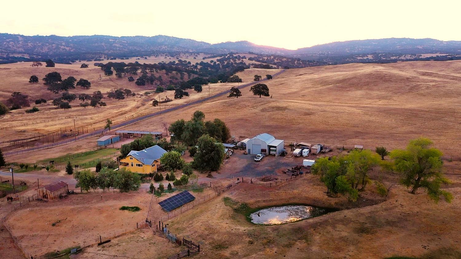 an aerial view of residential house and sandy dunes