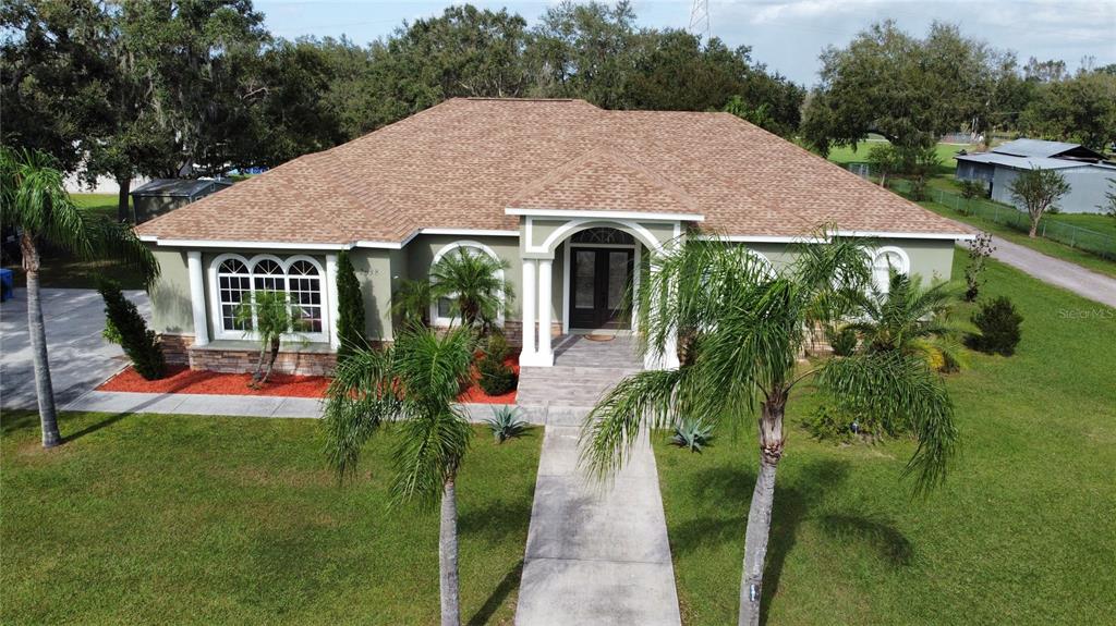 a aerial view of a house with garden