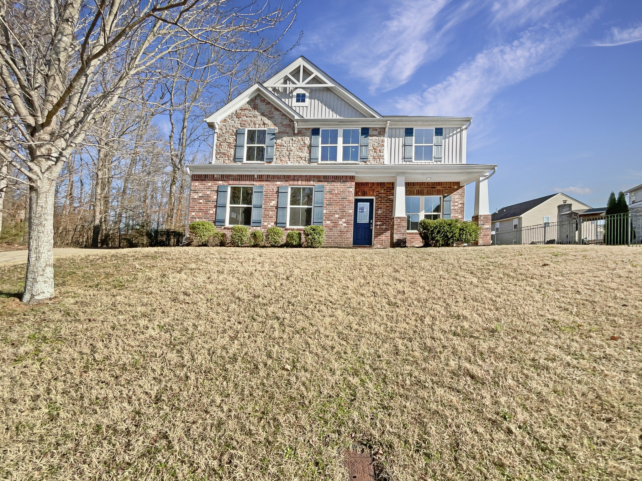 a front view of a house with a yard