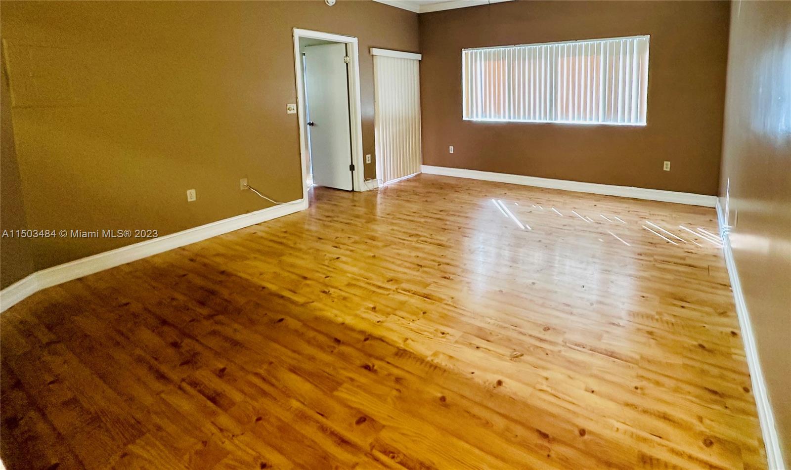 a view of an empty room and window