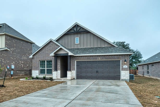 a front view of a house with yard