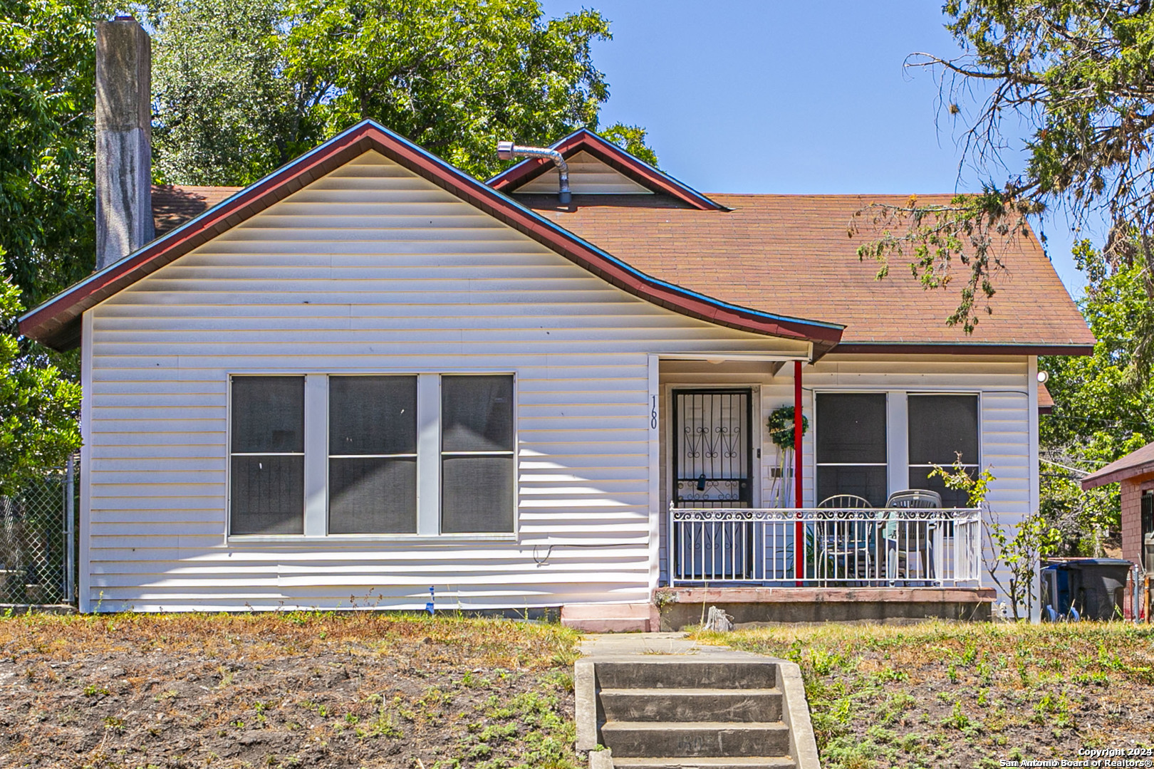 a front view of a house with a porch