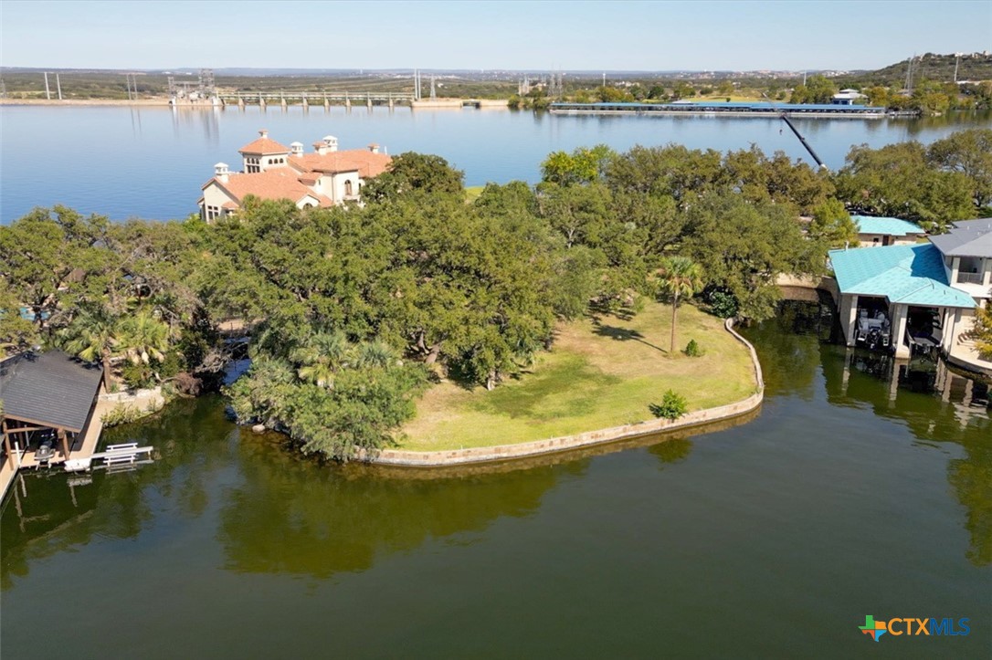 an aerial view of a house with a lake view