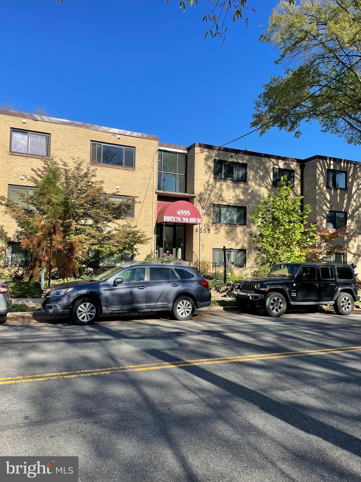 a view of a car parked in front of a building