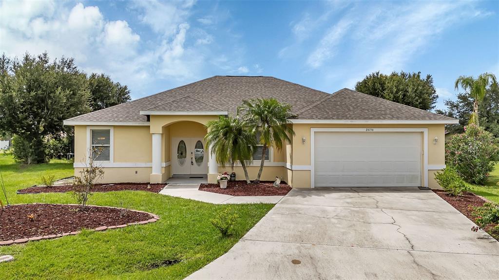 a front view of a house with a yard