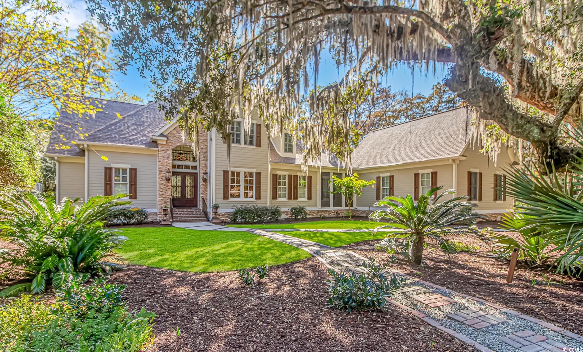 View of front of property with a front yard