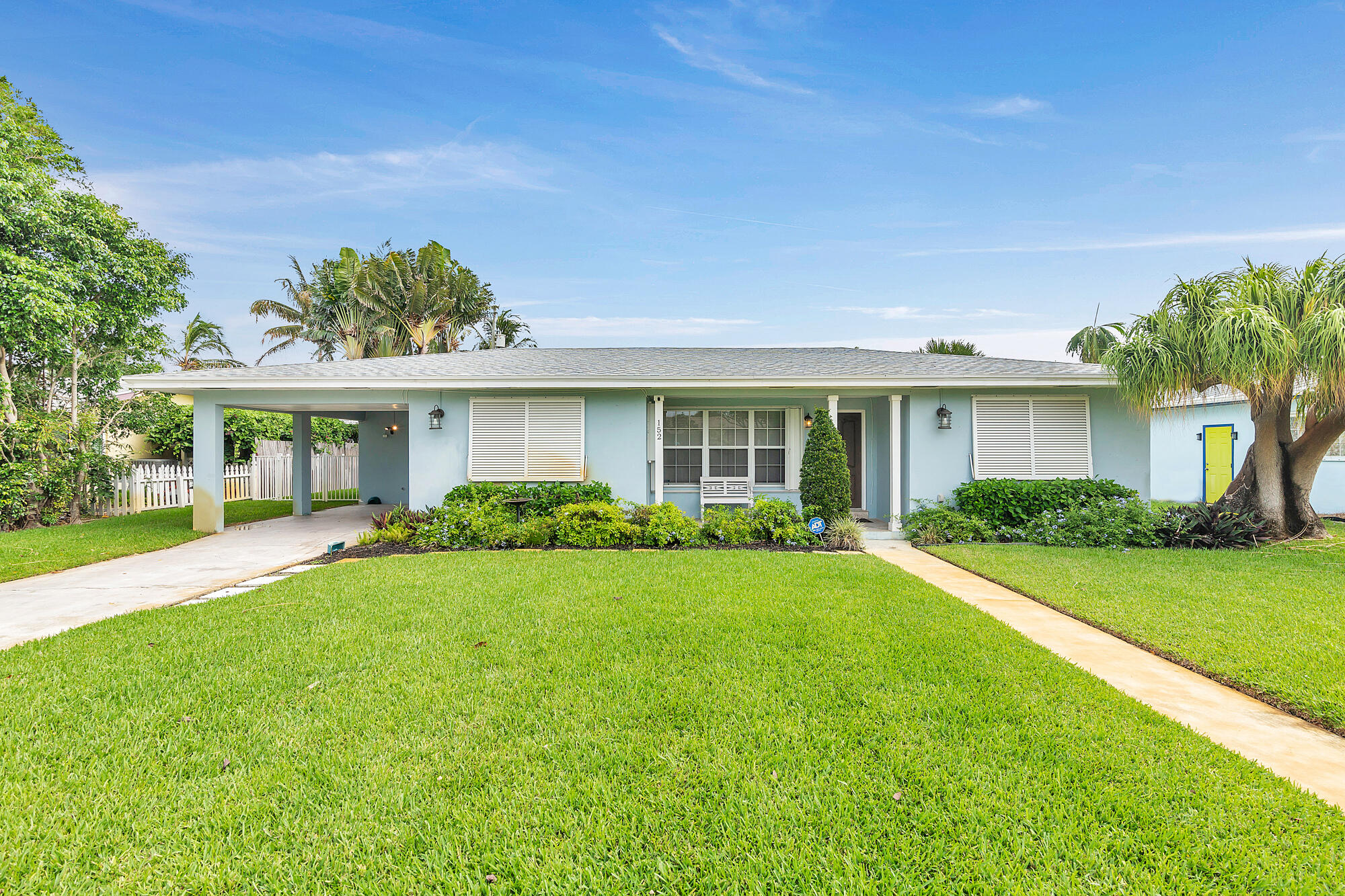 front view of a house with a yard