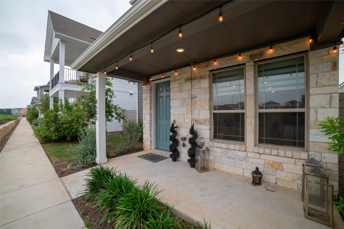 a building outdoor space with patio furniture and garden